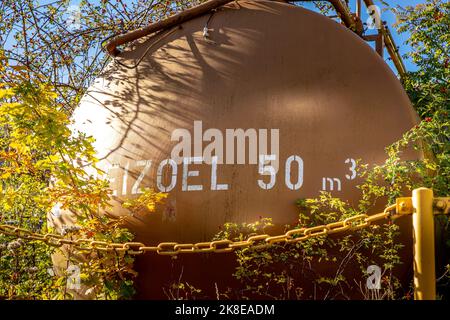 A little overgrown fuel oil tank Stock Photo