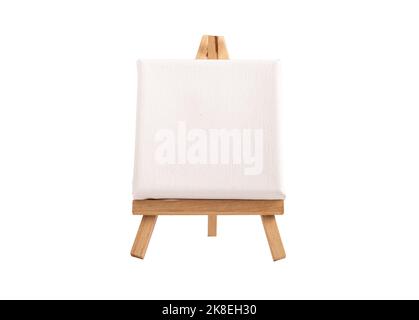 White blank square canvas mockup on wood easel tripod isolated on white background. High quality photo Stock Photo