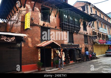 Thai women people and foreign travelers journey travel and walking on street visit take photo local life lifestyle of nepali in bazaar market old town Stock Photo