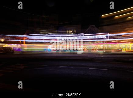Amusement arcade lit up at night in Scarborough with camera movement Stock Photo