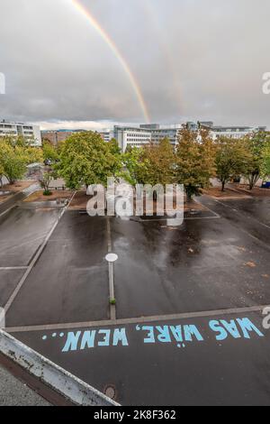 Double Rainbow over Friedrich Ebert Gymnasium Schoolyard text saying what if in federal government district aerial view Bonn city Germany Stock Photo