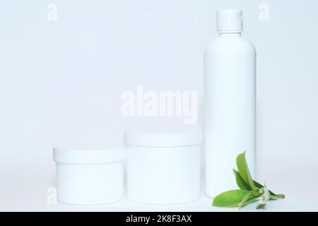 Cosmetic containers on isolated white background. Stock Photo