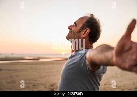 Man with eyes closed enjoying at beach Stock Photo