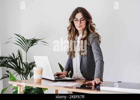 Young female engineer working in her modern office Stock Photo