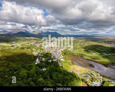 Ireland, Clifden - 05 23 2022: Areal view of Clifden, a coastal town in County Galway, Ireland, in the region of Connemara. Daylight, cloudy panorama. Stock Photo