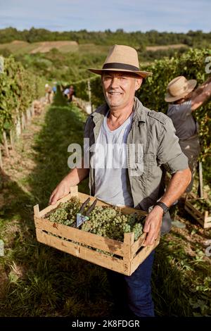 Smiling farmer with a straw hat Stock Photo - Alamy