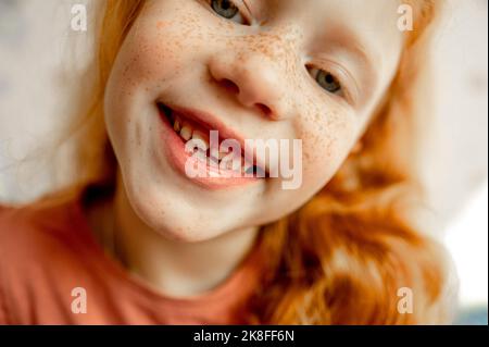 Cute smiling girl with redhead and freckles Stock Photo