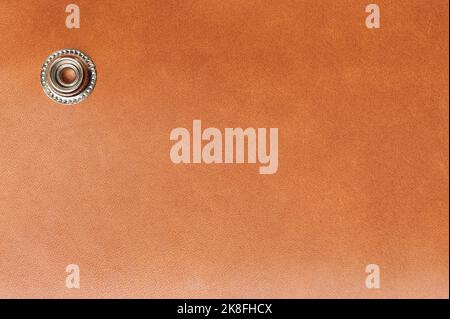 Metal rivert on leather wallet with copy space close up view Stock Photo