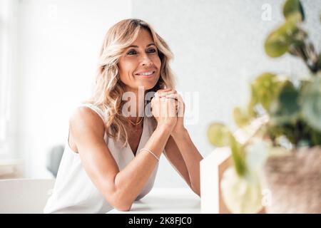 Contemplative architect smiling at office Stock Photo