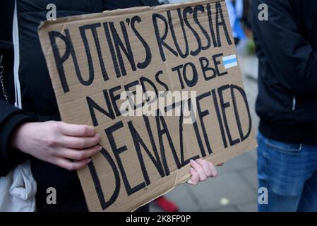 Warsaw, Warsaw, Poland. 23rd Oct, 2022. A protester holds a sign during a rally against war in Ukraine on October 23, 2022 in Warsaw, Poland. A few dozen of Russian citizens living in Poland rallied against the Russian attack on Ukraine and Vladimir Putin's regime under the slogan ''Solidarity against war''. Their supporters from Ukraine, Belarus and Poland also took part in the rally. (Credit Image: © Aleksander Kalka/ZUMA Press Wire) Credit: ZUMA Press, Inc./Alamy Live News Stock Photo