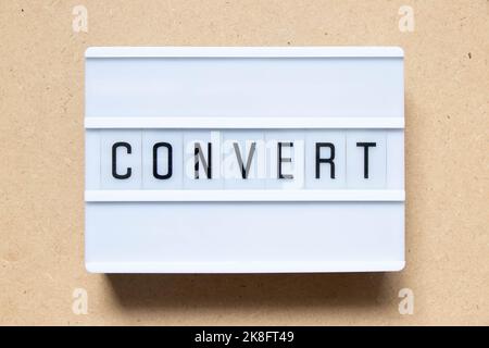 Lightbox with word convert on wood background Stock Photo