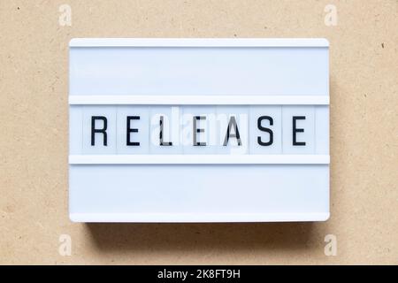 Lightbox with word release on wood background Stock Photo