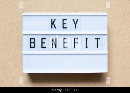 Lightbox with word key benefit on wood background Stock Photo