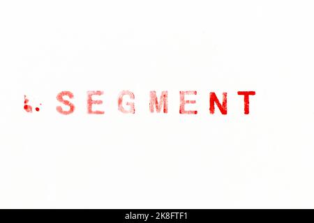 Red color ink rubber stamp in word segment on white paper background Stock Photo