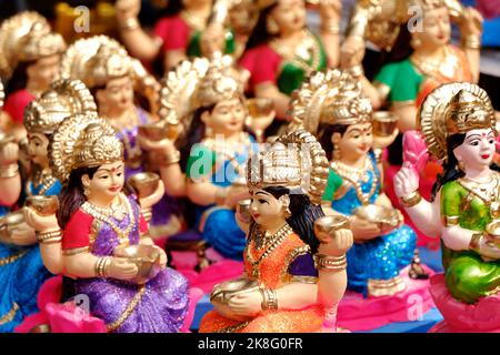 Beautiful statues of godess Lakshmi displayed for sale during festival of Diwali in Pune, India. Handcrafted Laxmi idols. Stock Photo