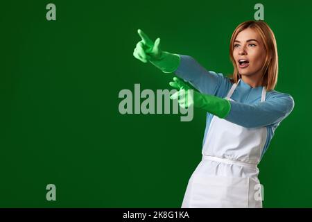 woman in gloves pointing fingers at copy space Stock Photo