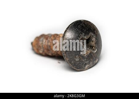 Old rusted screws on a white background Stock Photo