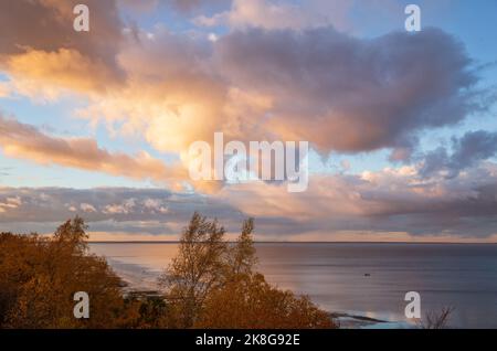 Autumn evening on Lake Ilmen, the clouds are beautifully illuminated by the setting sun Stock Photo