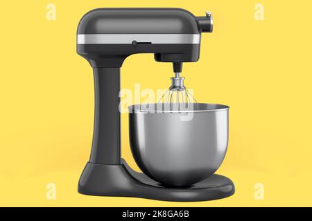 Modern kitchen mixer for cooking, blending and mixing on yellow background. Stock Photo