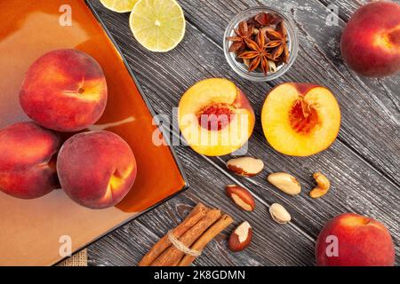 sliced peach on wood background top view Stock Photo