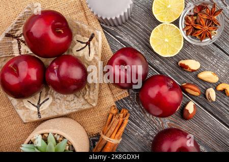 plum group on wood background top view Stock Photo
