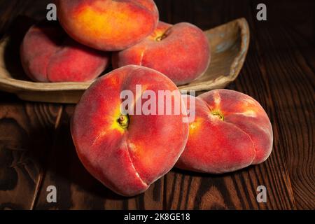 flat peach on wood background Stock Photo