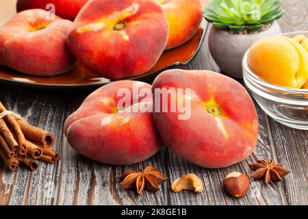 flat peach on wood background Stock Photo