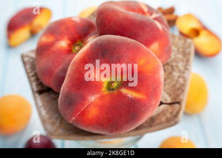 flat peach on wood background Stock Photo