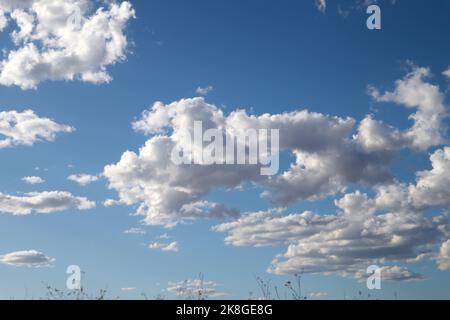 Image of the sky with clouds and clearings that threaten a storm in the blue autumn sky Stock Photo