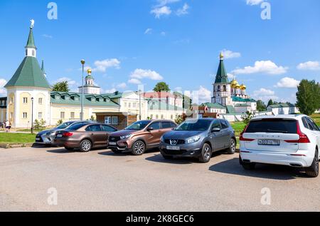 Valday, Russia - August 6, 2022: Parking lot with vehicles next the Valdai Iversky Monastery Stock Photo