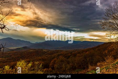 Sunrise in the mountains before the sun appears above the horizon Stock Photo