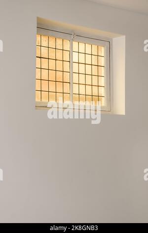 From below window on a white wall Stock Photo