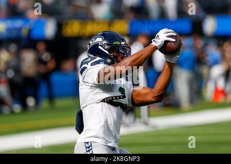 Seattle Seahawks wide receiver Dee Eskridge (1) lands outside the end zone  after catching a pass under pressure from Dallas Cowboys safety Tyler  Coyle, right, in the first half of a preseason