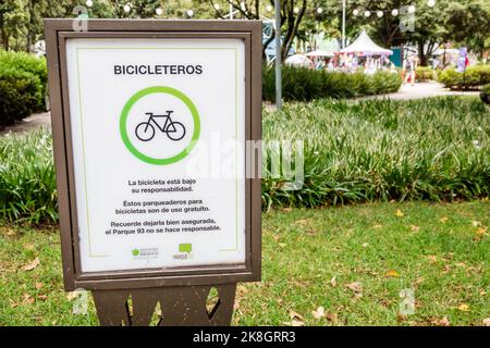 Bogota Colombia,El Chico Parque de la 93 Be Happy Fest,sign Spanish language bicycle bike parking rack disclaimer,Colombian Colombians Hispanic Hispan Stock Photo
