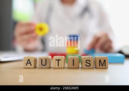 Word autism collected with wooden letters cubes Stock Photo