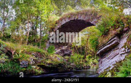 The old, packhorse, arched bridge of Livet in Speyside Stock Photo