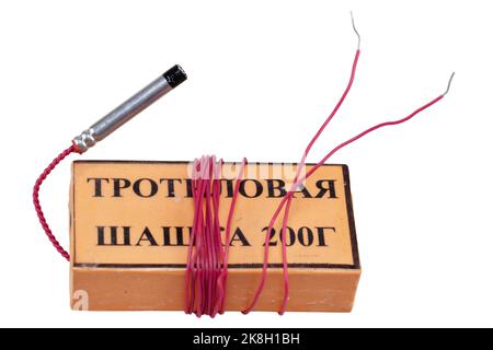 TNT explosive block 200 gram. russian-soviet type with electric blasting cap. Isolated on white background. Inscription in russian on the photo: 'TNT Stock Photo