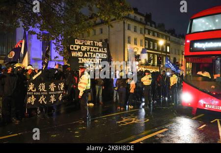 London, UK. 24th Oct, 2022. Protesters seen outside the Chinese Embassy during the rally. Around a hundred people marched from Downing Street to the Chinese Embassy in London, via Chinatown, during a thunderstorm. The protest is in response to the Chinese Consulate incident in Manchester on October 17, 2022, in which a Hong Kong protester was reportedly dragged and beaten by the staff. (Photo by Jasmine Leung/SOPA Images/Sipa USA) Credit: Sipa USA/Alamy Live News Stock Photo