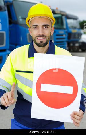 workman making stop sign Stock Photo