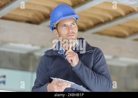 close-up portrait of a smart builder thinking about something Stock Photo