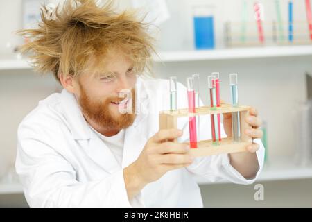 crazy scientist in laboratory amazed by results of his research Stock Photo