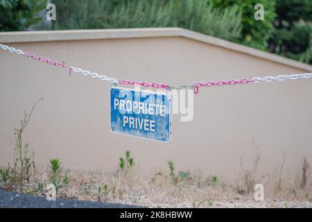 private property sign at the entrance to a house. sign with text written in french that means private property Stock Photo