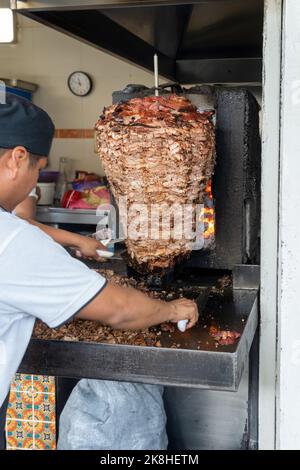 Mexican food Trompo Pastor tacos al pastor, beef stacked in sauce with spices Stock Photo