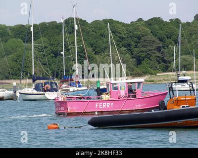 Pink painted Hamble Warsash Ferry Emily on the Hamble River, Southampton, Hampshire, UK Stock Photo