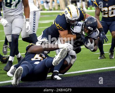 Los Angeles Chargers Troy Reeder (42) tackles Seattle Seahawks running back Kenneth Walker for a third quarter safety at SoFi Stadium in Inglewood, California on Sunday, October 23, 2022. The Seahawks defeated the Chargers 37-23. Photo by Jon SooHoo/UPI Stock Photo