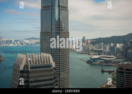 Detail of the roof structure of 1ifc and the middle floors of 2ifc, Hong Kong Island's tallest building, with Wan Chai and Victoria Harbour beyond Stock Photo