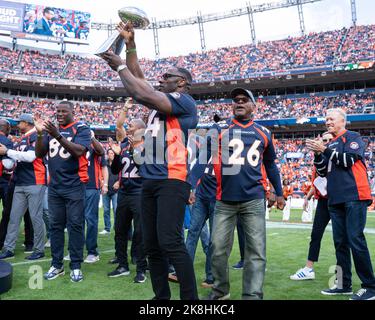 Shannon Sharpe of the Denver Broncos holds the Lombardi Trophy