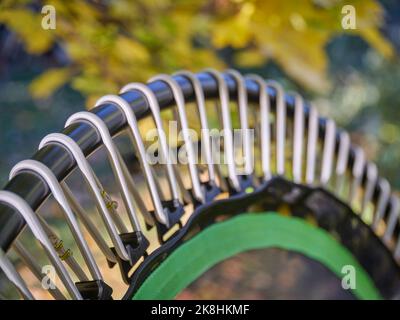 detail of mini trampoline for fitness exercising and rebounding in a backyard, abstract of fall scenery Stock Photo