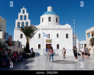 Town of Oia with the church of Panagia Platsani. Greek Cyclades island of Santorini in the Aegean Sea. Stock Photo