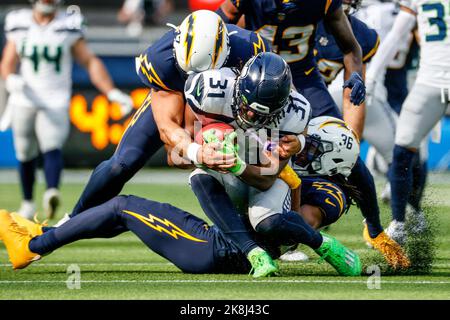 Los Angeles, California, USA. 23rd Oct, 2022. Seattle Seahawks running back DeeJay Dallas (31) is brought down by Los Angeles Chargers defensive back Ja'Sir Taylor (36) and long snapper Josh Harris (47) during the first half at an NFL football game, Saturday, Oct. 23, 2022, in Inglewood, Calif. (Credit Image: © Ringo Chiu/ZUMA Press Wire) Stock Photo